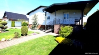 Titelbild - Gepflegtes Einfamilienhaus mit Gartenidylle, Pool und moderner Technik